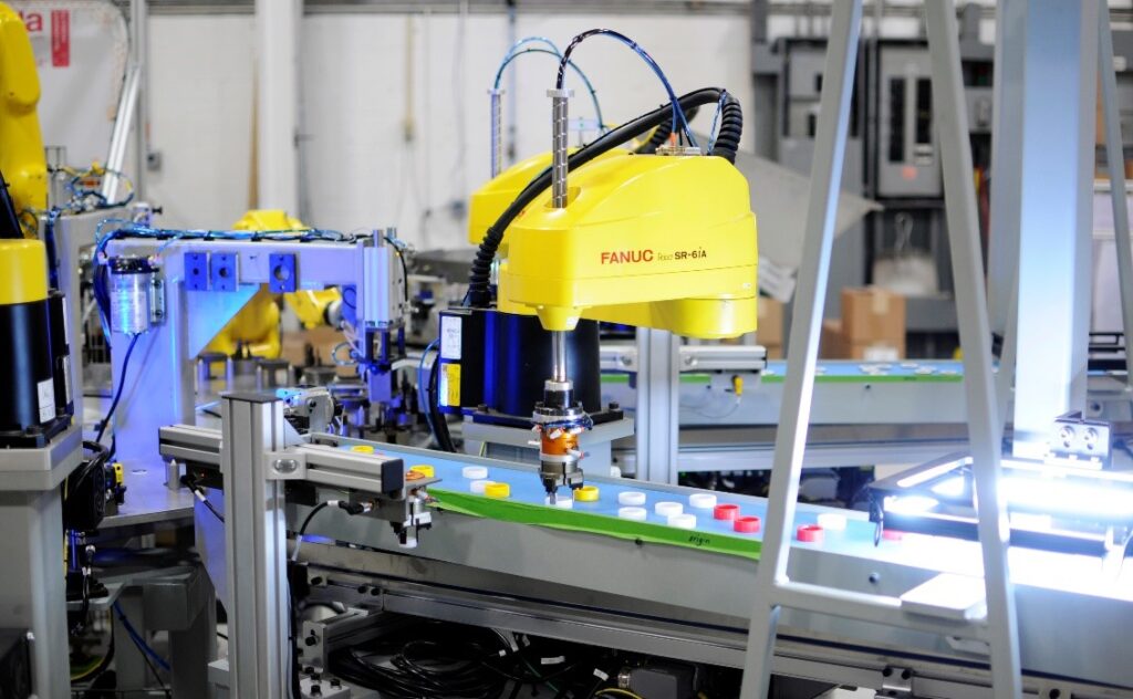 FANUC SCARA robot picking parts from a conveyor