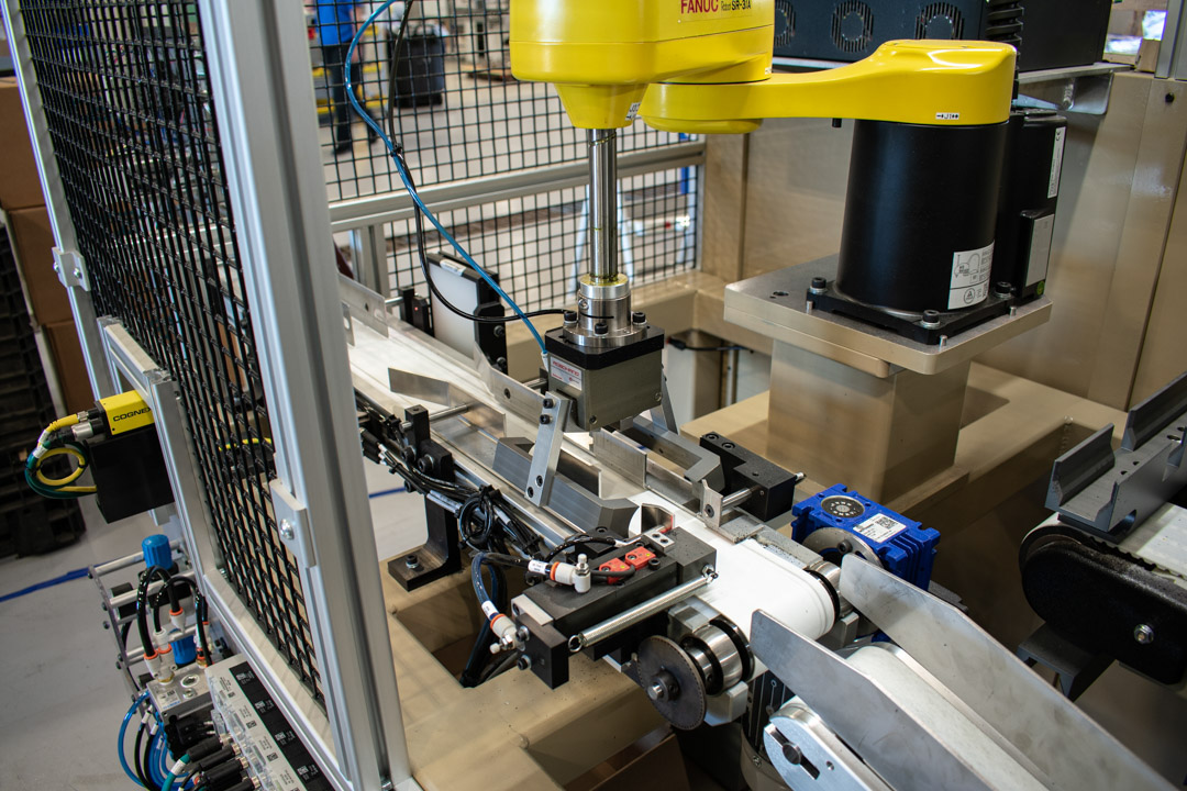 FANUC SCARA robot integrated on an assembly and testing machine