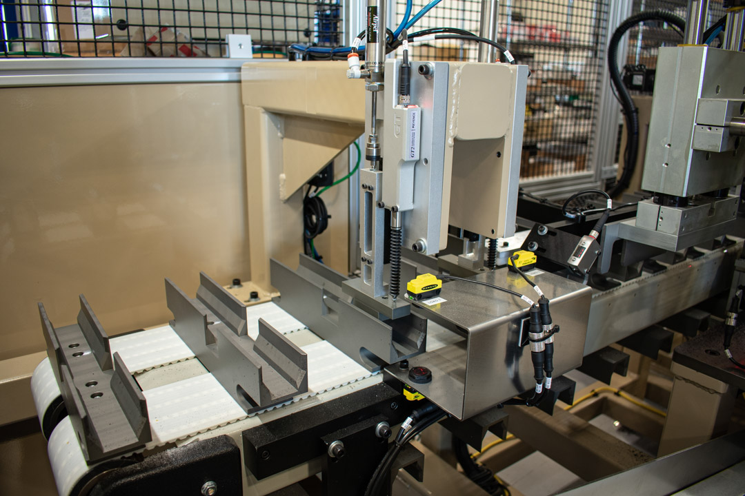 Custom corrugated tube nests on an indexing conveyor