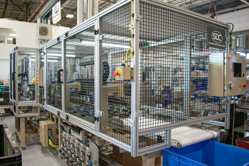 Machine guarding mounted on an appliance hose assembly and testing machine