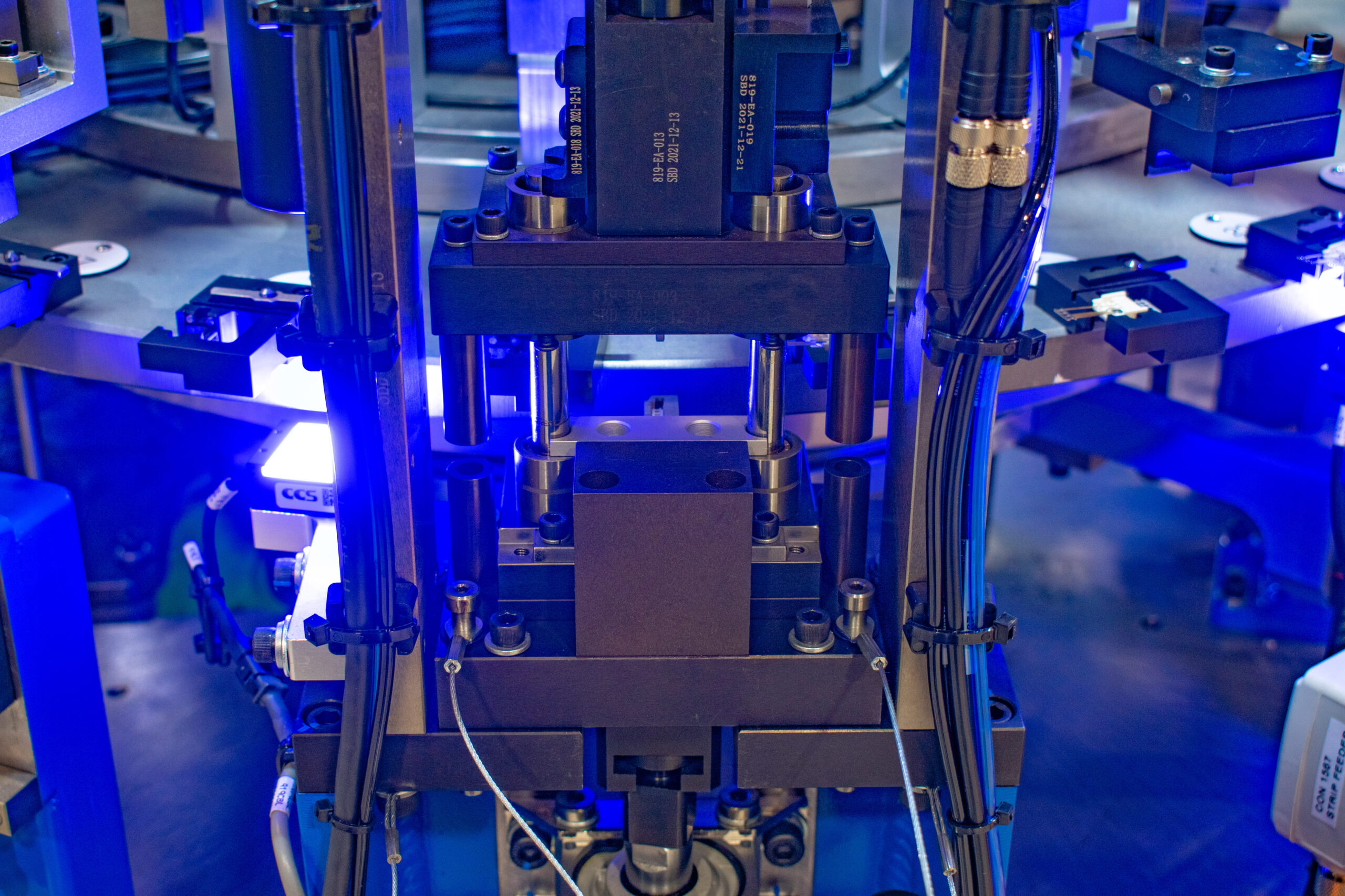 Metal stamp/press/form equipment on a high-speed small part assembly machine