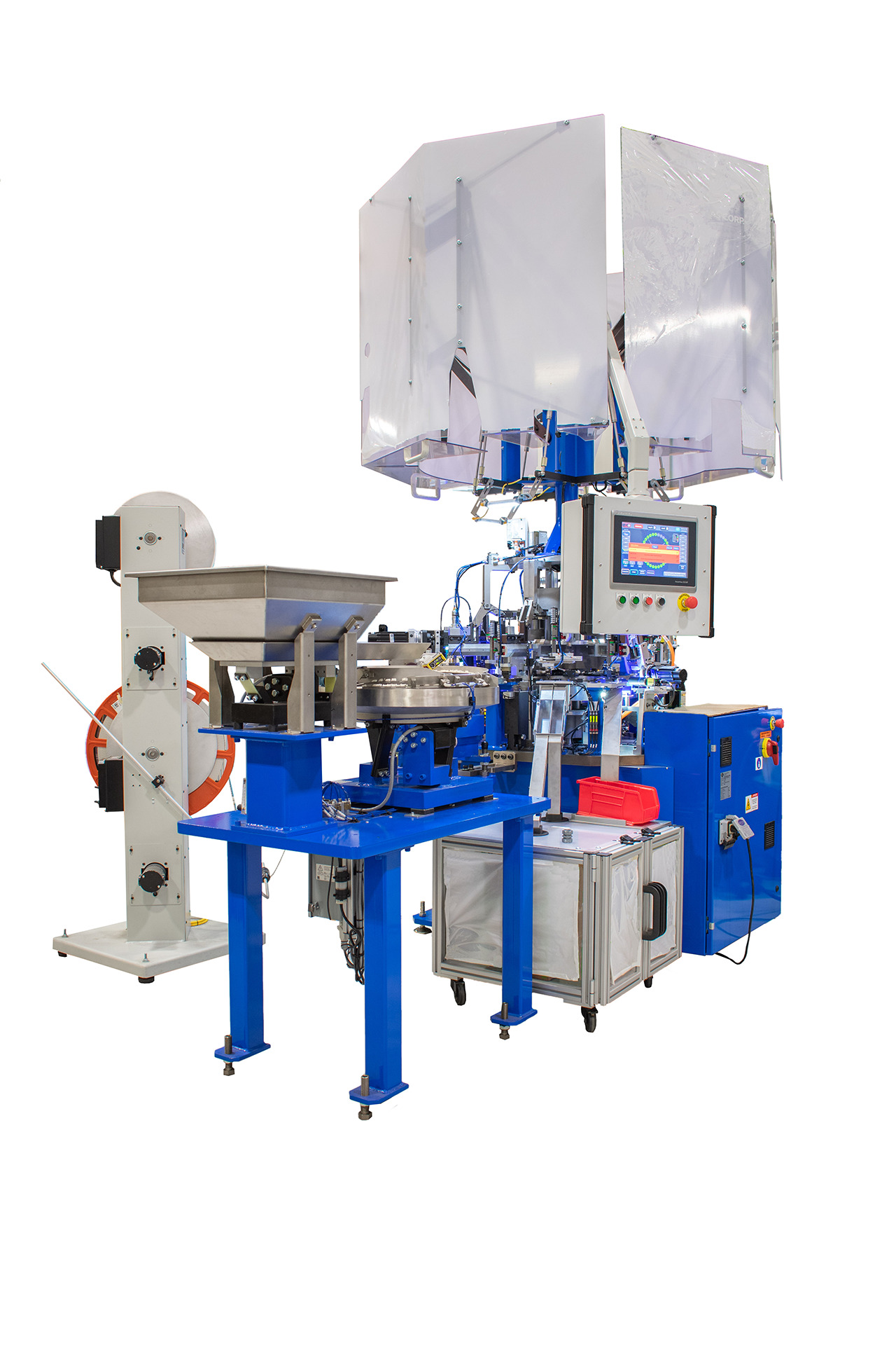 Machine features a blue frame, a silvery stainless steel feeder bowl and hopper at the left, a small control panel with a touch screen and buttons, and safety shields on top made of transparent plastic.