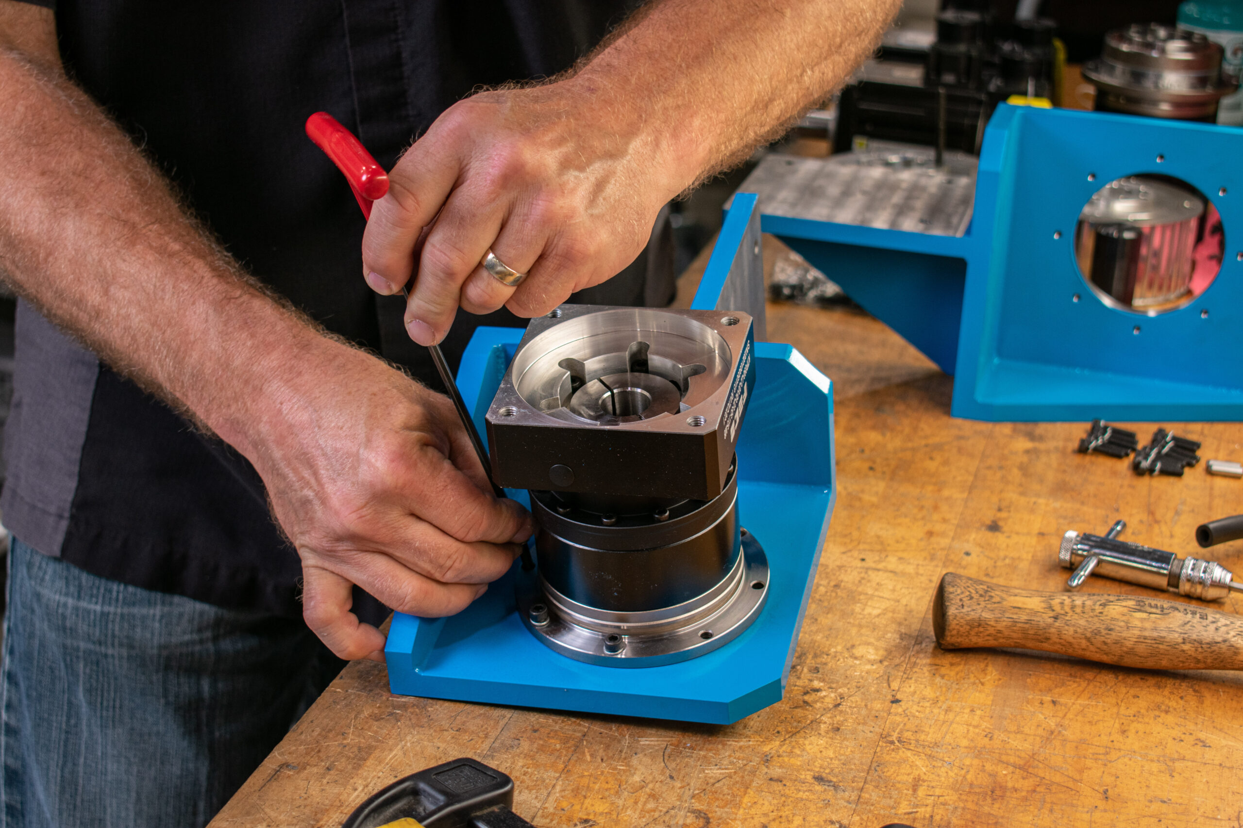 Mechanical machine assembly of part on a shop desk