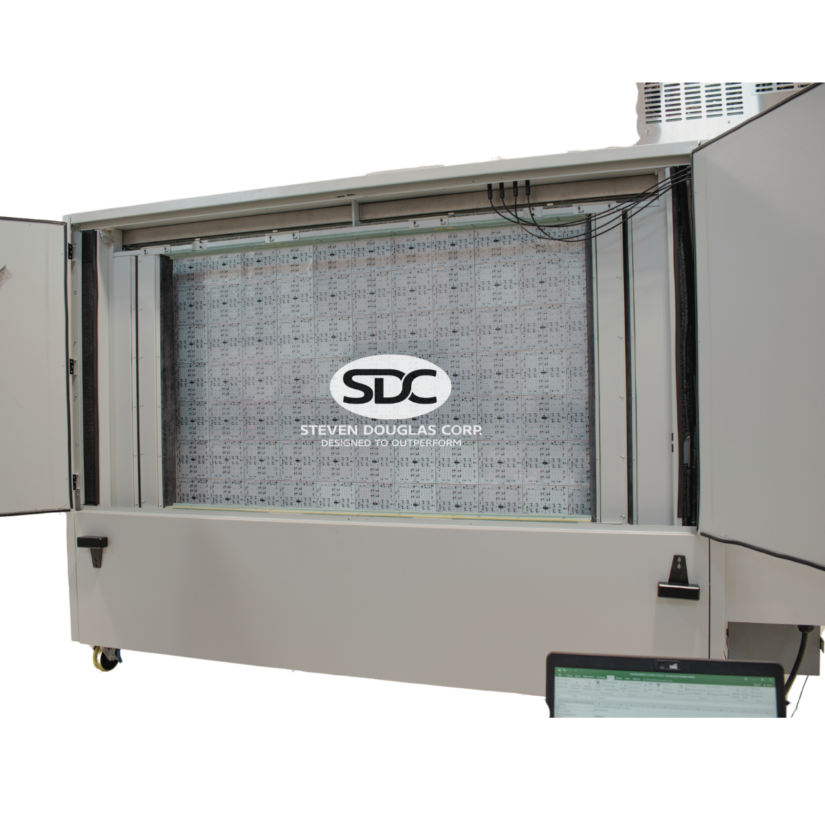 SDC's electronic testing unit with open panels revealing circuit board array and company logo.