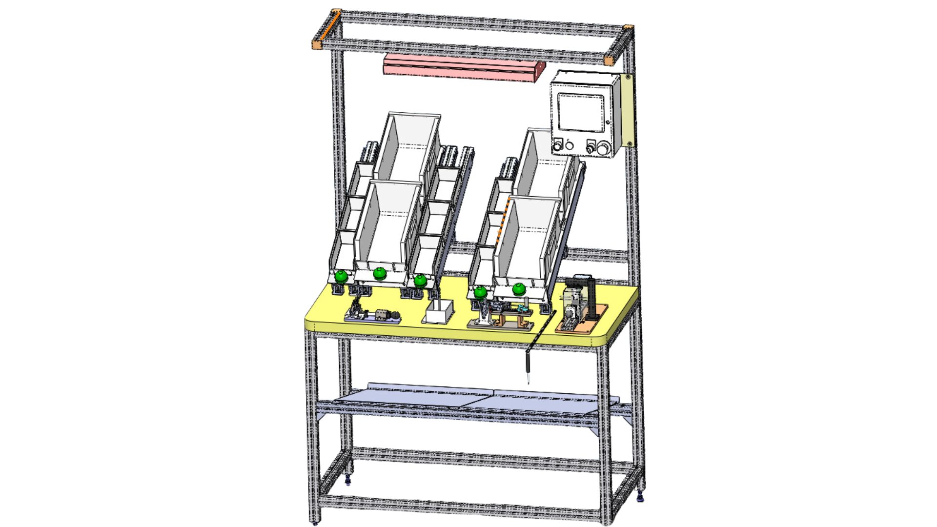 Automated workstation with feeders, control panel, and yellow work surface on a metal frame.