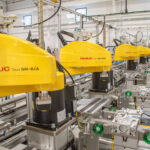 Large-scale Automated Production Line with FANUC SCARA robots at their pick-and-place stations.