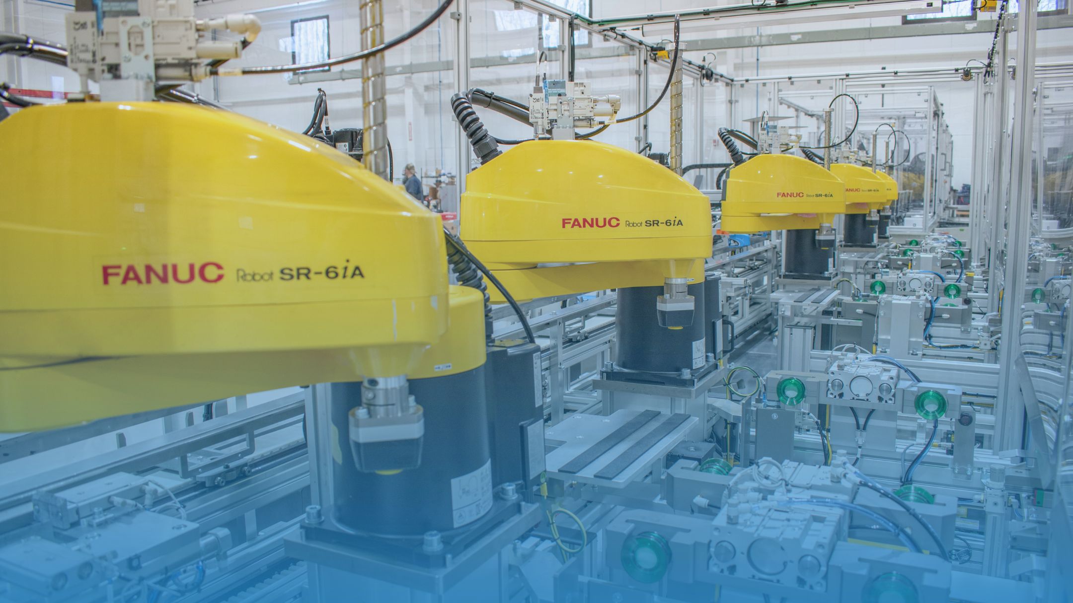 Lineup of FANUC SCARA robots on an automated production line