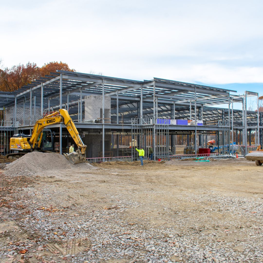 Photo from when SDC was in the building phase. Metal frame on dirt ground.