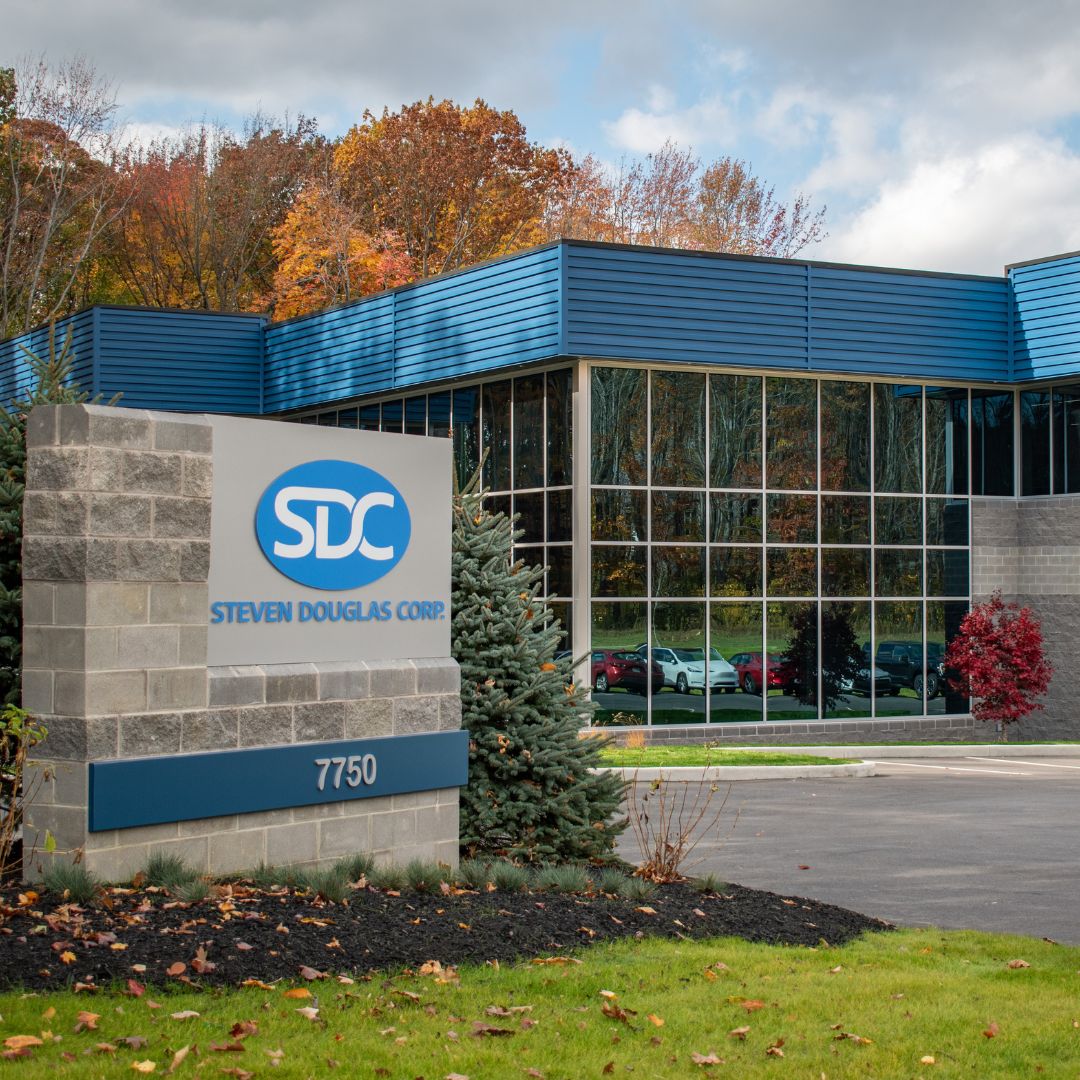 Exterior of SDC building on a clear day with a focus on the main SDC signage out front.