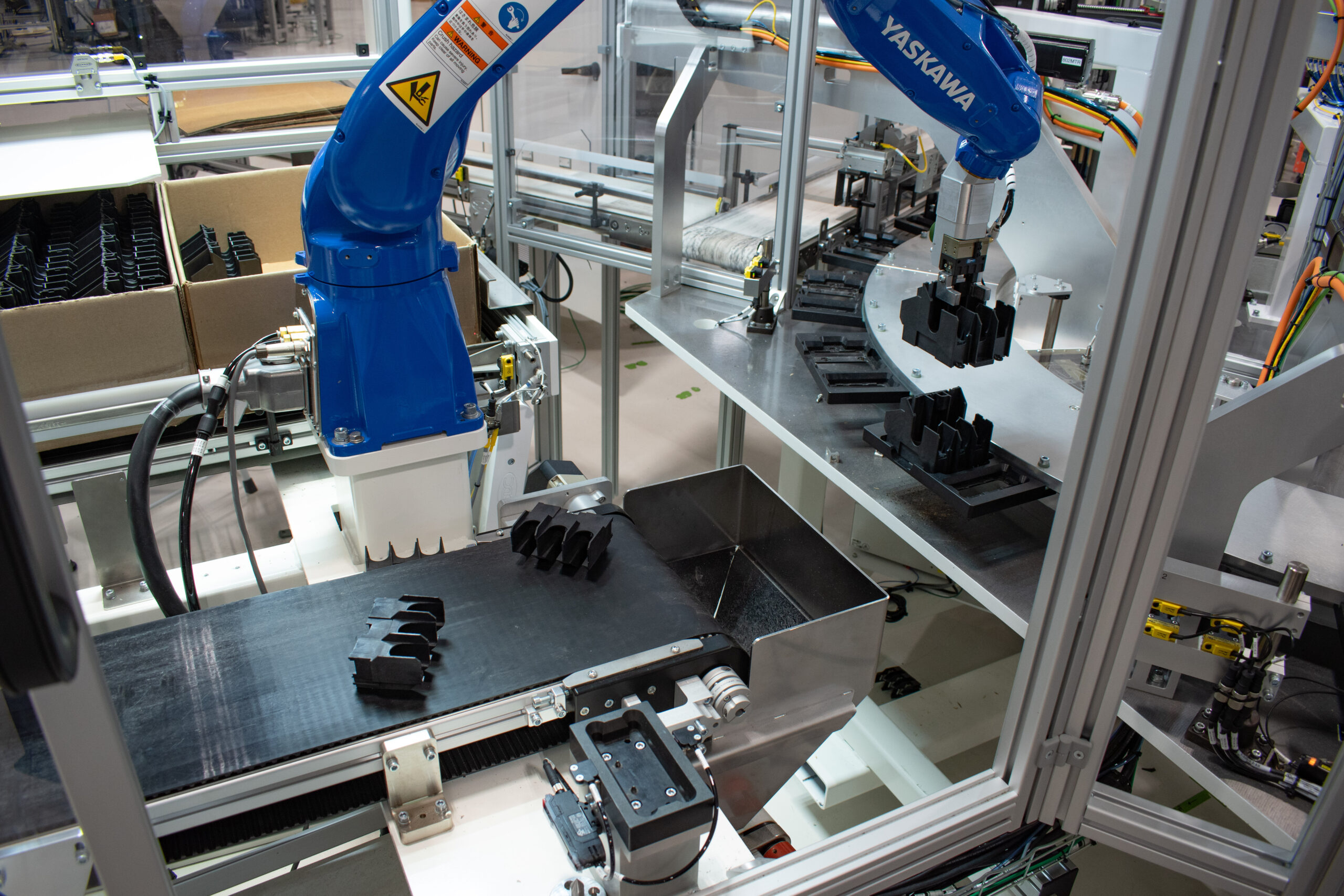Yaskawa 6-axis robot performing a hybrid flex feeding and bin picking process