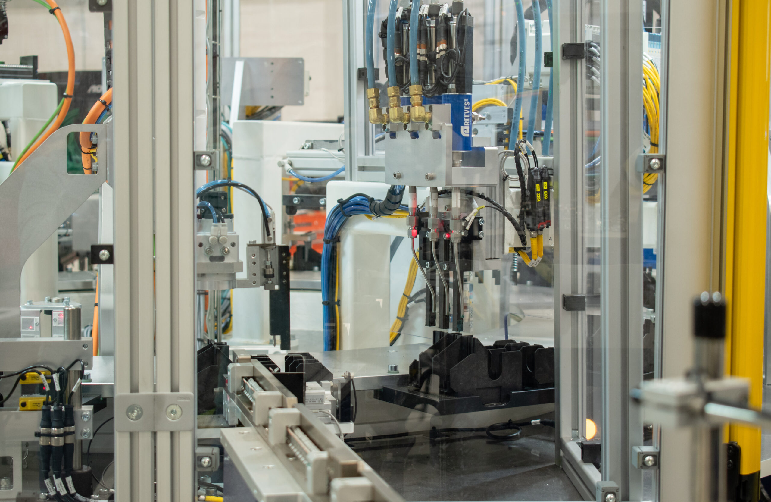Grease dispensing station on a semi-automated assembly machine with an SDC Indexing Ring