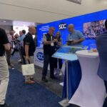 The SDC team talking with a potential customer in the SDC booth at Automate