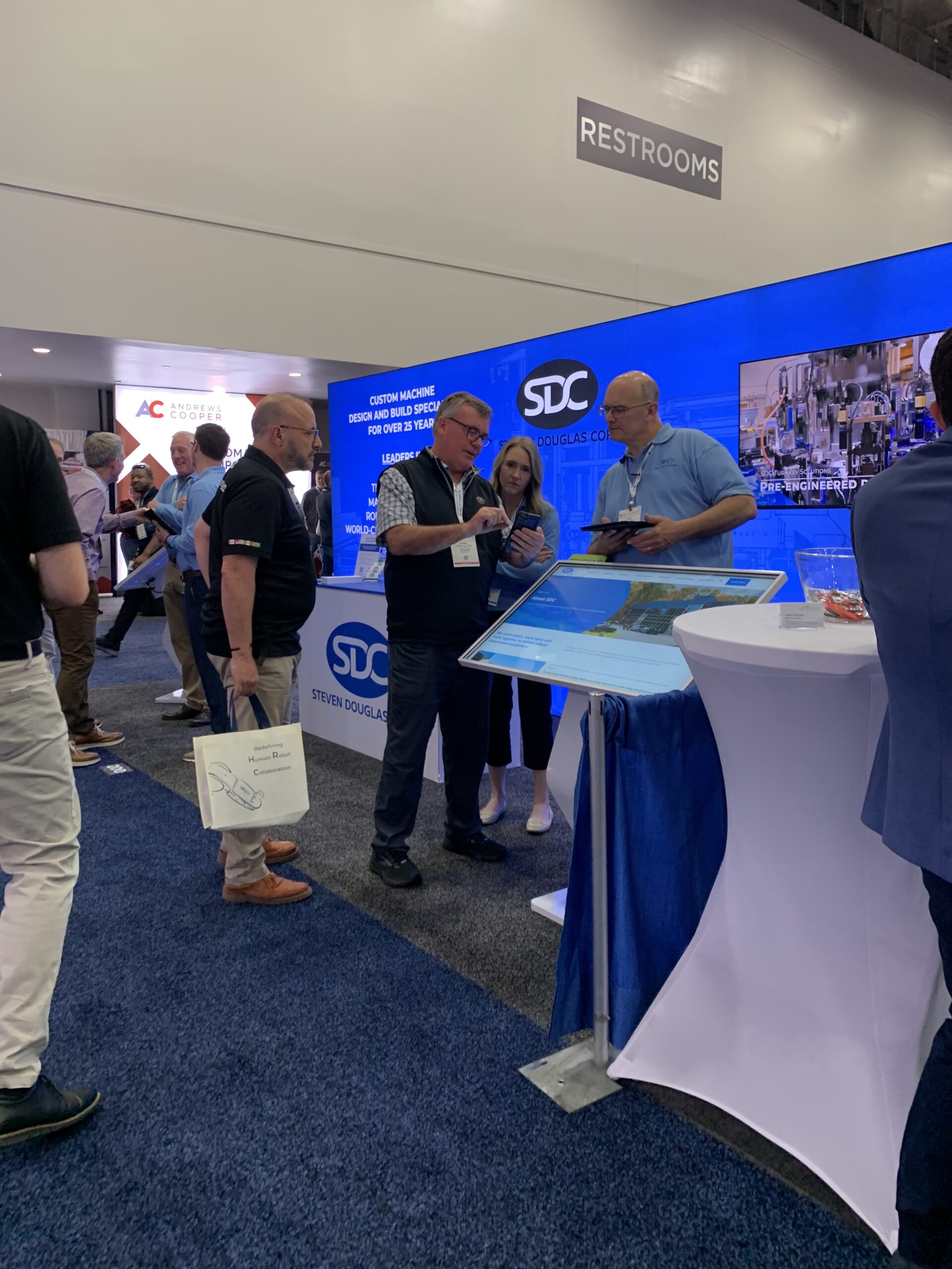 The SDC team talking with a potential customer in the SDC booth at Automate