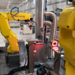 FANUC robots mounted on a medical device assembly automated machine