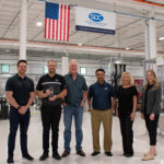 Several members of the SDC team accepting the 2024 Outstanding Sales Growth Award from FANUC