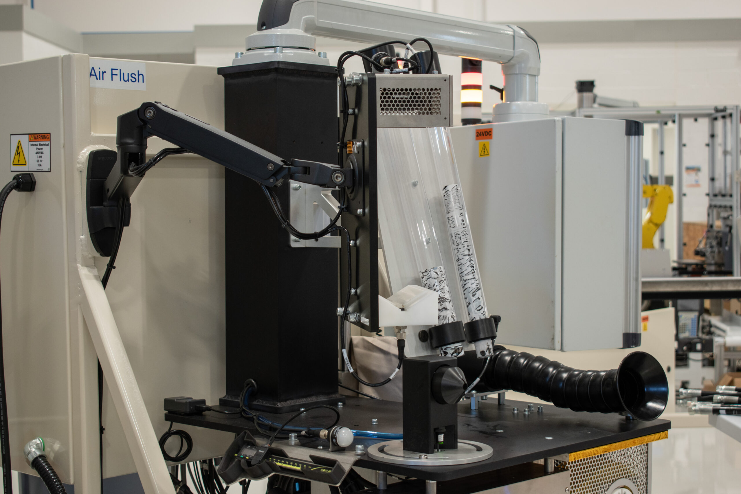 Semi-automated hose flushing unit