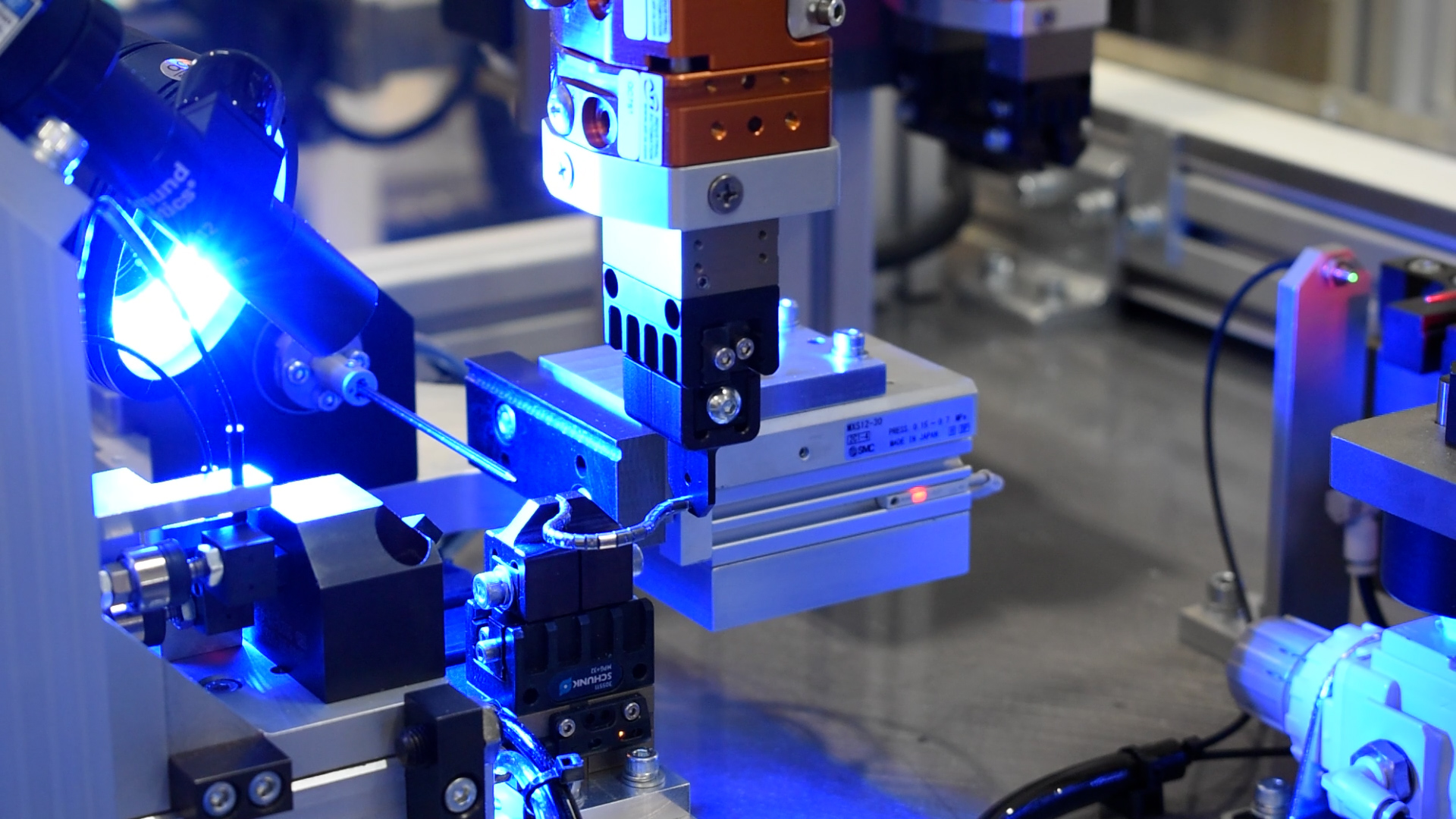 Lighted testing station for a small medical component after assembly