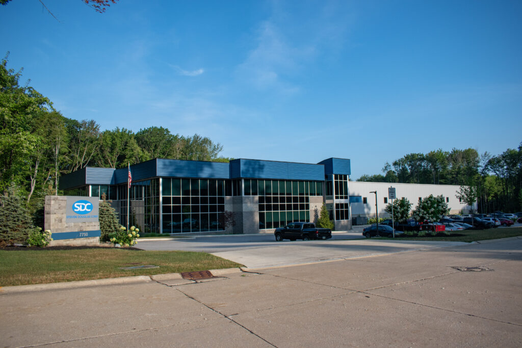 Whole view of the SDC building and road sign in the summer