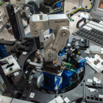 A Mecademic robot on a mini indexing dial