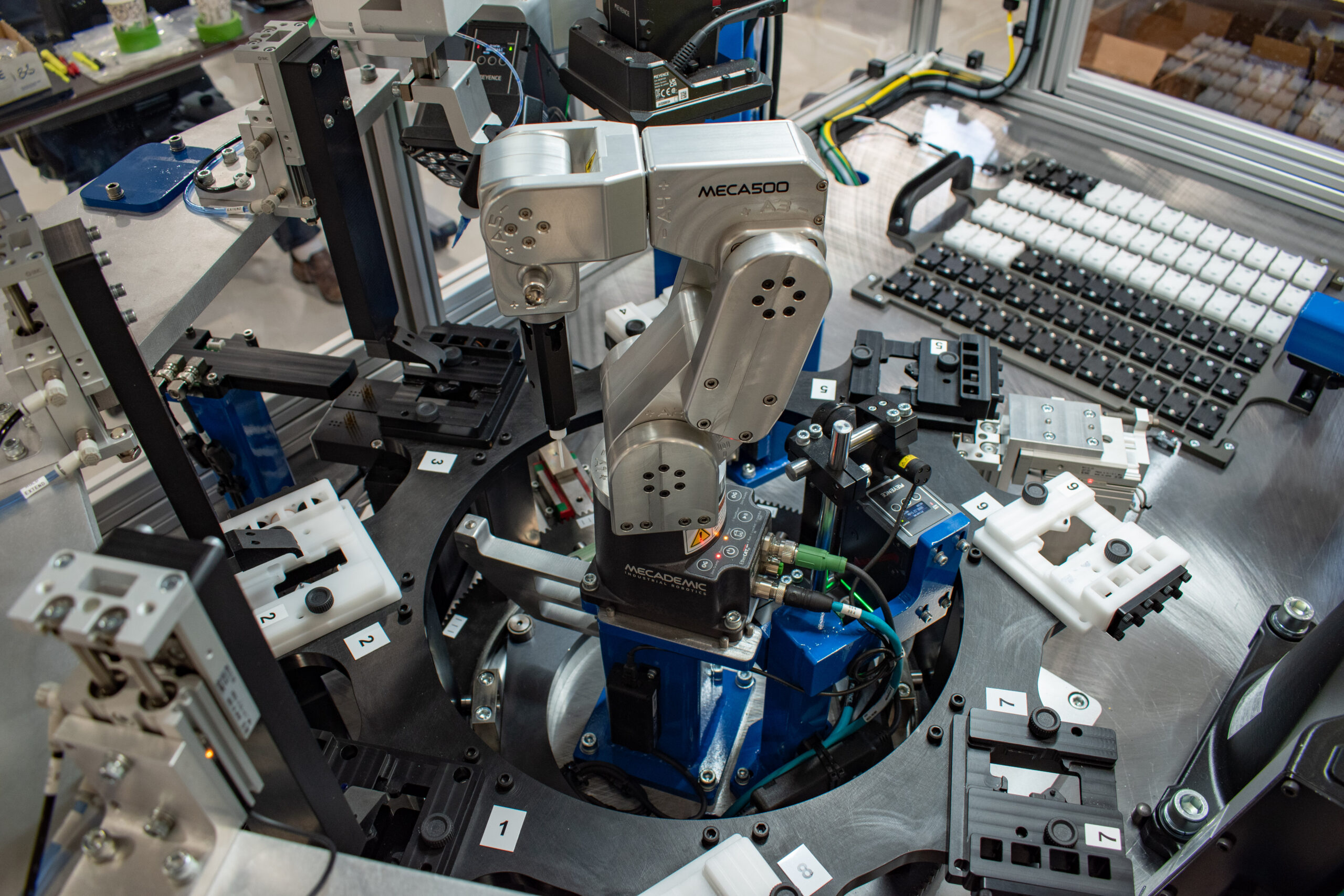 A Mecademic robot on a mini indexing dial
