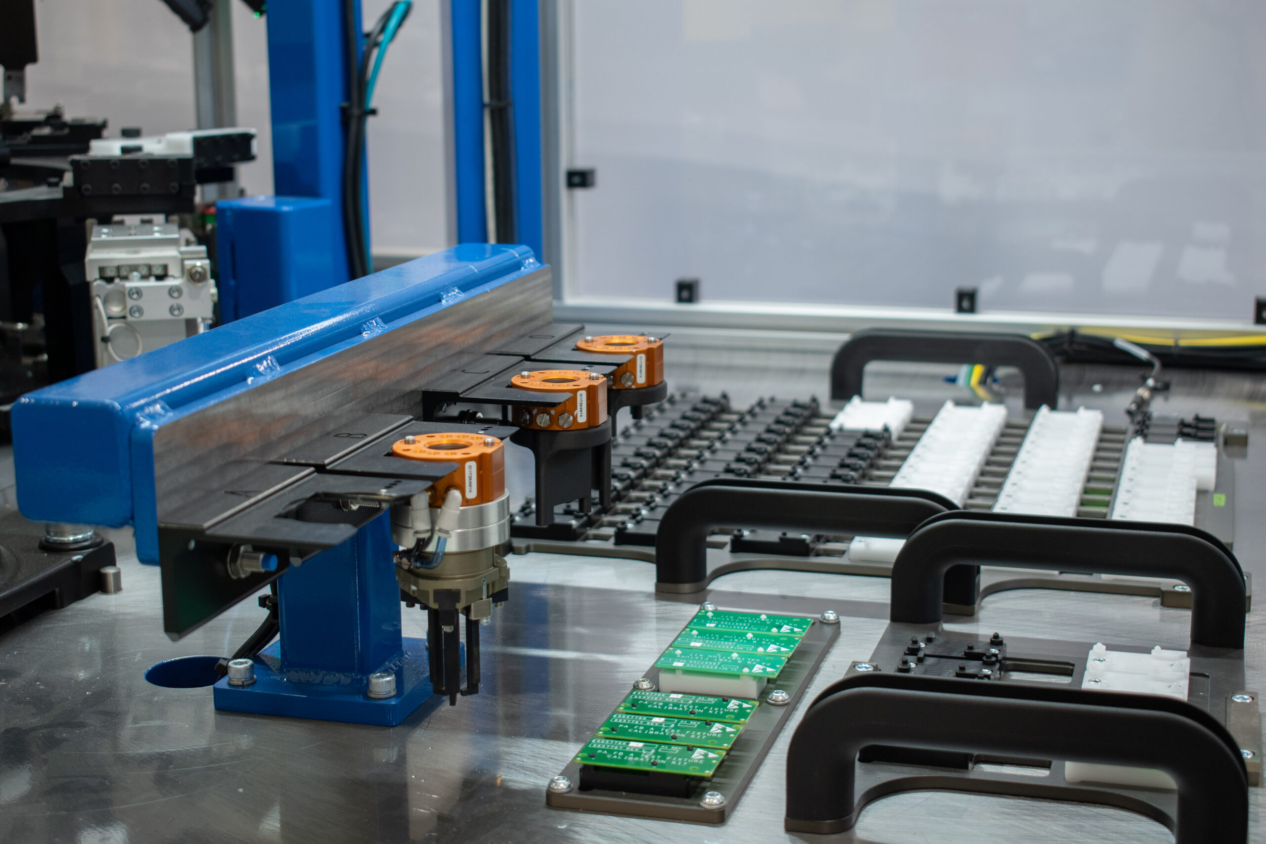 Three ATI tool changers and an automatic tool changing station