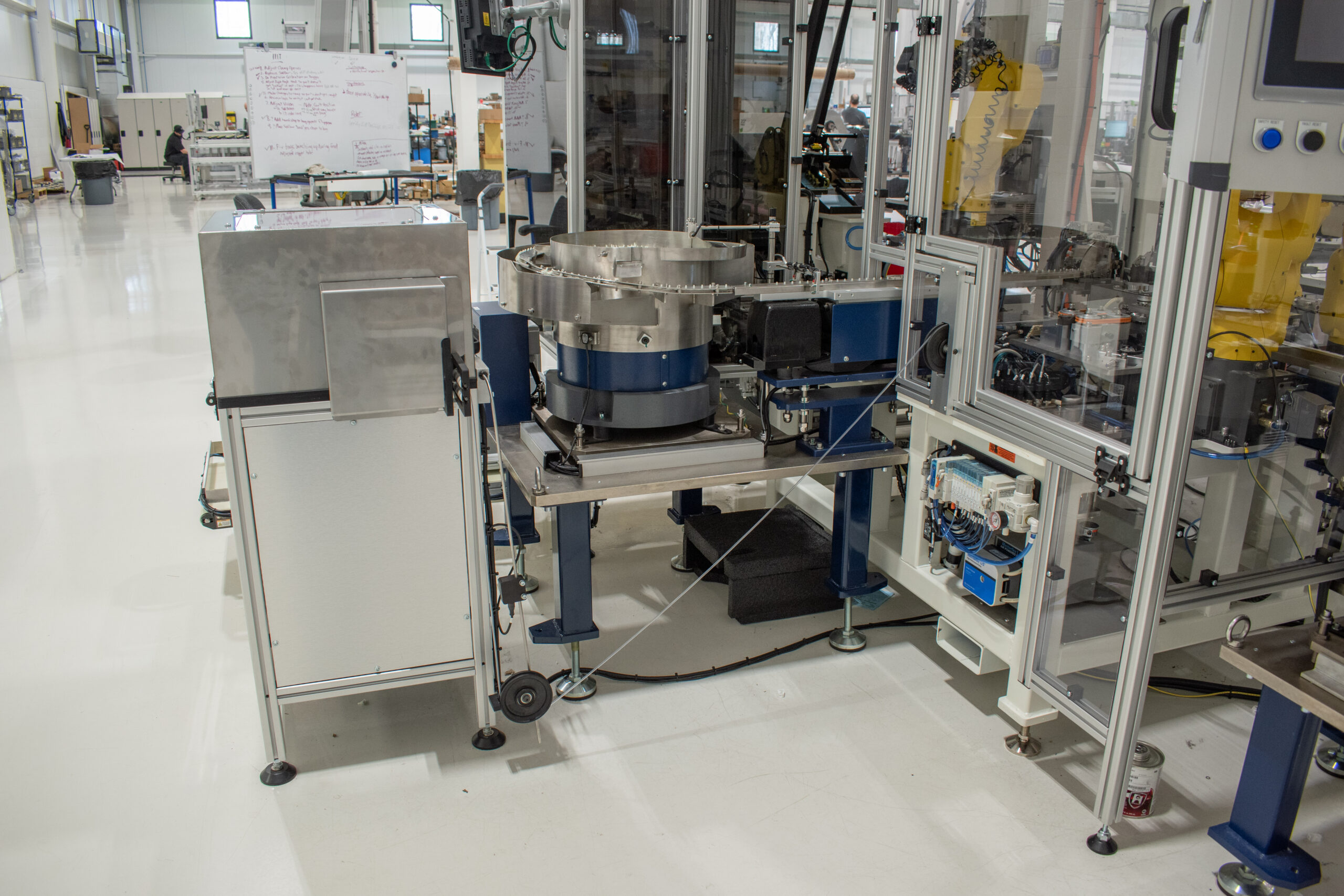 SDC's custom tube dereeling system with a weighted dancer and a Bellco feeder bowl behind it