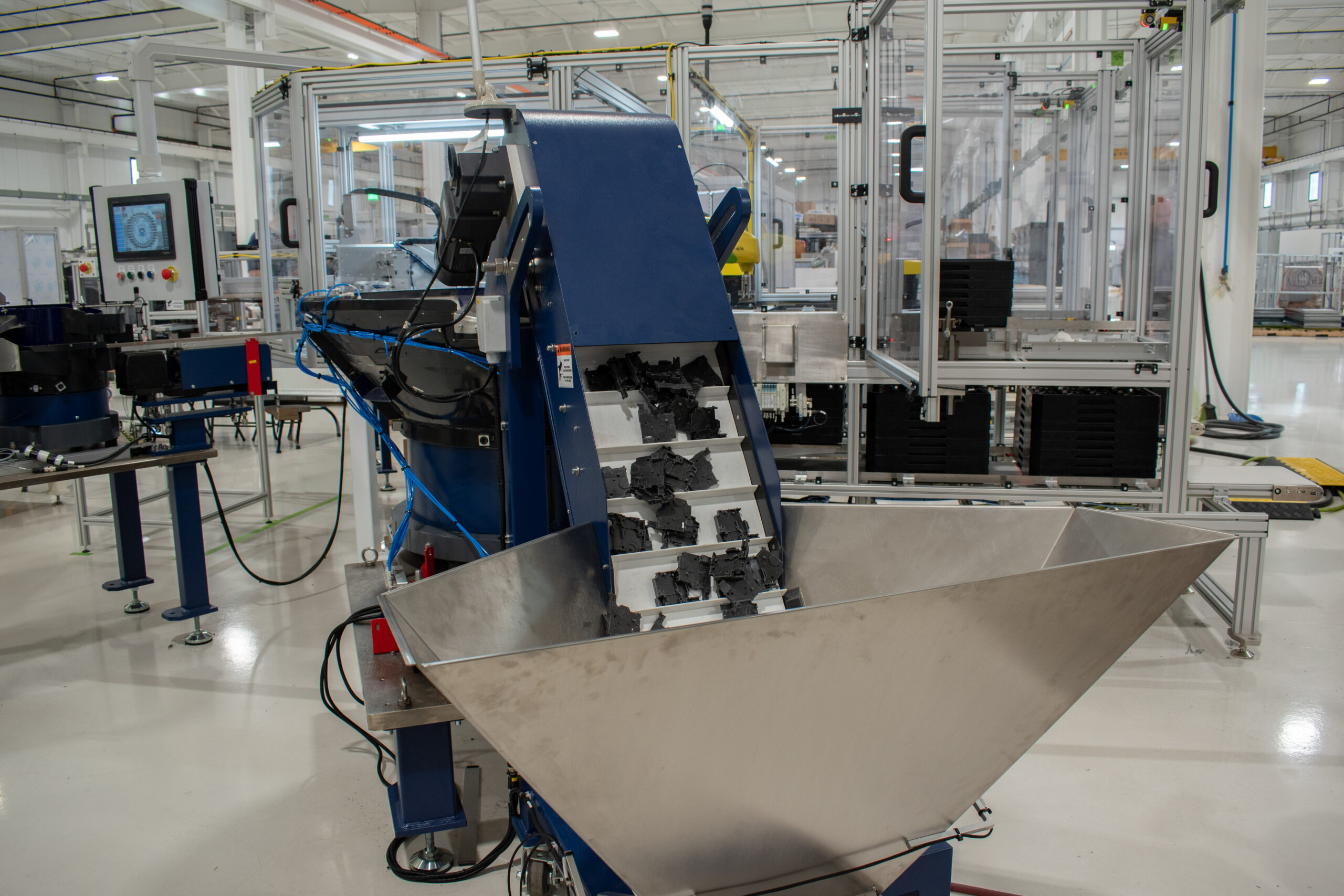 Large part feeding hopper and conveyor for circuit board covers