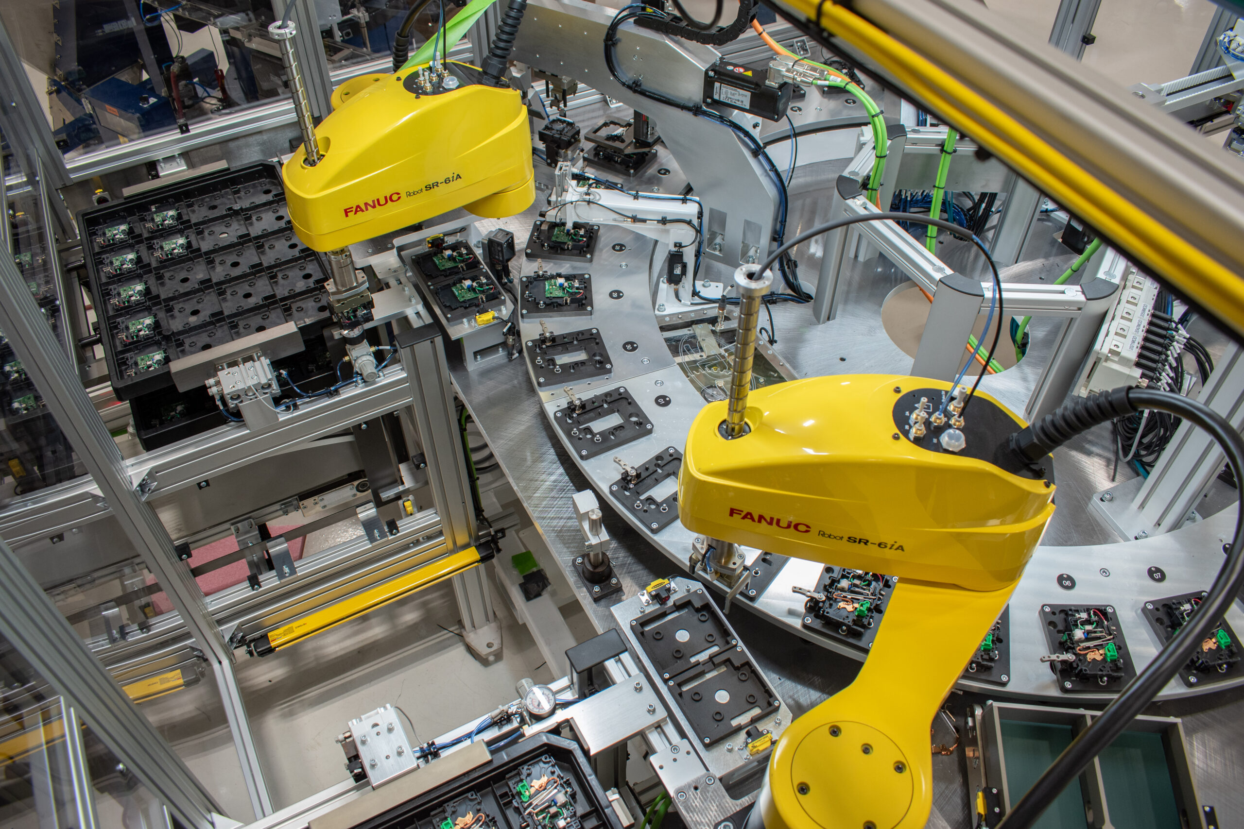 Load and unload stations with SDC Tray Handlers on an automated machine