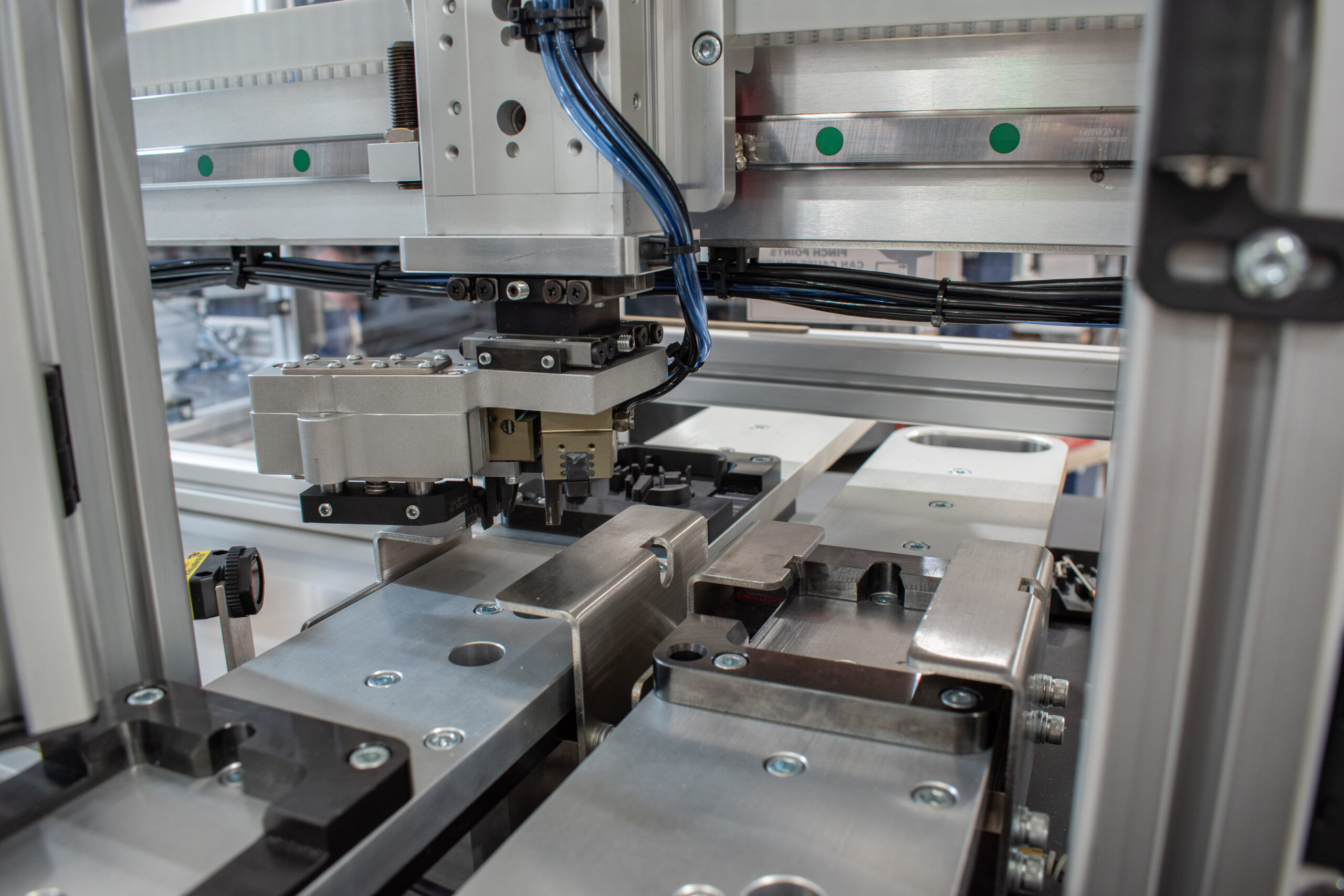 Semi-automated station on an automated assembly machine